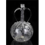 18th Century glass decanter, the slender neck with a pair of arched handles above a leaf and bird