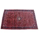 Hamadan rug, the red field with central blue medallion, the field with geometric panels and