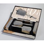 George V cased silver vanity set, Birmingham 1936, maker Broadway and Co, with engine turned