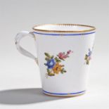 18th Century porcelain cup, circa 1770, the tapering body with hand painted flower sprigs and a