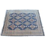 Persian carpet, the grey/blue field with bands of medallions to a multi edge border, 372cm x 293cm