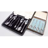 Cased silver flatware, to include a cased set of spoons with the card suits to the tops,