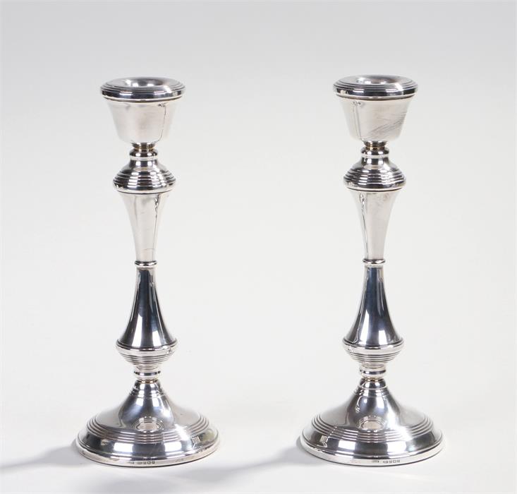 Pair of Elizabeth II silver candlesticks, Birmingham 1995, maker Broadway and Co, weighted, 20.5cm