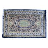 Persian silk rug, the oval bands with blues and yellows and foliate border, 196cm x 130cm