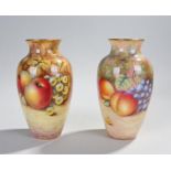 Pair of Royal Worcester vases, decorated by Alan Telford and J Smith, with a gilt edge above the