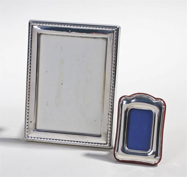 Two silver frames, the larger example London 1989 maker R. Carr Ltd, 12cm wide the smaller one