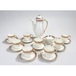 Royal Doulton coffee service, decorated with a cream ground and blue with gilt edging, consisting of