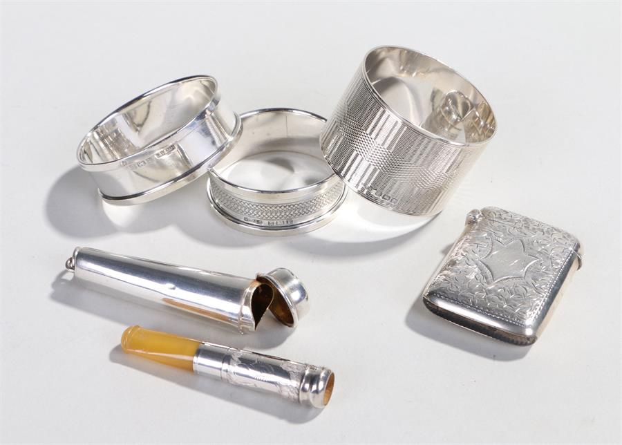 Silver objects, to include three silver napkin rings, a Victorian silver cheroot holder case,