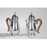 Pair of George V silver chocolate pots, London 1928, maker Mappin & Webb, the finial topped lid