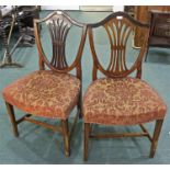 Pair of mahogany Regency style dining chairs, the arched top above a splat back and a stuff over