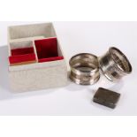 Boxed pair of napkin rings, Birmingham 1971, together with a silver box, Birmingham 1909, 46 grams