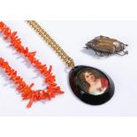 Jewellery, to include a coral necklace, a silver beetle brooch and a portrait pendant, (3)