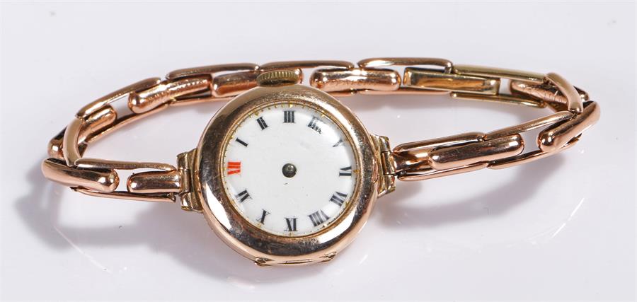 9 carat gold ladies wristwatch, the white enamel dial, manual wound, with 9 carat gold elasticated