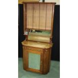 Early 20th Century mahogany cabinet on stand, the bookcase top above a bow front top and frieze