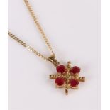 9 carat gold pendant necklace, set with four red stone, the pendant 12mm diameter