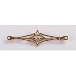 9 carat gold brooch, set with stones to the centre, 50mm wide