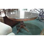 Mahogany and walnut inlaid breakfast table the circular top above a turned column and cabriole legs