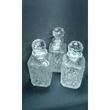 Three cut glass decanters, with facetted stoppers, (3)