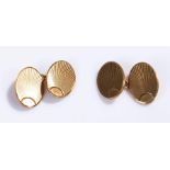 9 carat gold pair of cufflinks, with engine turned discs, 10 grams