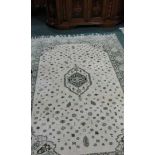 Persian rug, with a cream field and geometric design, 297cm long, 205cm wide