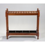 Mahogany stick stand, with stick compartments above a tray