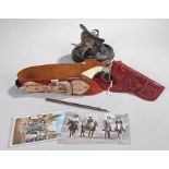 Buffalo Bill interest, to include an Inkwell, postcards and a toy pistol, together with a cased