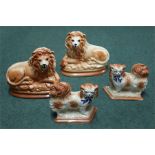 A pair of Staffordshire lions together with a pair of Staffordshie Pekingese dogs (4)