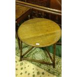 18th Century style oak cricket table, the circular top above turned legs, 58cm wide