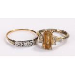 Yellow metal diamond set ring, the head set with three diamonds, together with a costume ring