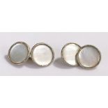 Pair of mother of pearl and white metal cufflink, of disc form