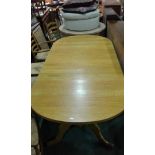 Large oak dining table, with rectangular top with rounded ends above turned supports and cabriole