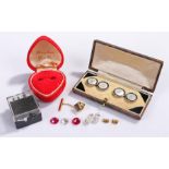Cased cufflink set, with mother of pearl centres, together with a button clip, silver ear studs