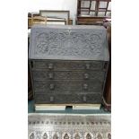 Victorian oak bureau, carved with grape vines and lion mask handles