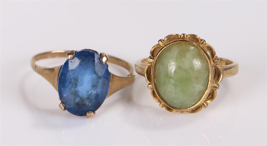 Two 9 carat gold rings, the first set with a blue paste stone, the second with a jade stone, (2)