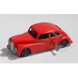 Mettoy tin plate saloon car, in red with black wheels, 16cm long