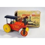 Mechanical steam roller tin plate toy, automatic reversible action, made in Great Britain, boxed