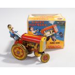 Mettoy Happy Hayseed tin plate toy, and his bucking tractor, no 6430, boxed