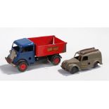 Tri-ang Minic clockwork truck, with a blue cap and red tipper back with the text Minic Transport,