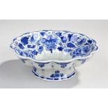 Delft pottery bowl, with foliate blue painted bowl with grapes to the base of the bowl, signed to