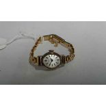 Timex 9 carat gold ladies wristwatch, with a signed silvered dial