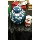 Chinese ginger jar in blue and white together with a Japanese Imari vase, (2)