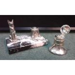 Two inkwells, with first with a dog by the well and a pen tray together with a silver plated