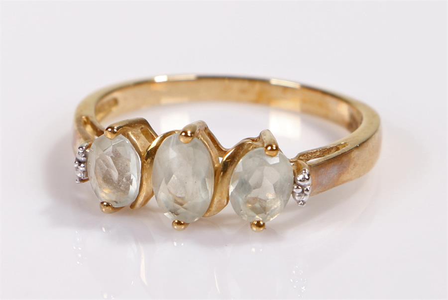 9 carat gold ring, set with three pale blue stones, ring size Q