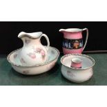 Large jug, basin and chamber pot decorated with roses also to include a large jug in pink with