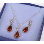 Amber and silver jewellery set, to include a pear shaped amber pendant on necklace and a