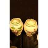 Two hand painted stoneware jars with lids, (2)