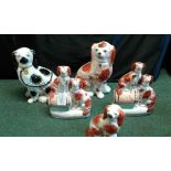 A collection of Staffordshire Pottery dogs, (5)