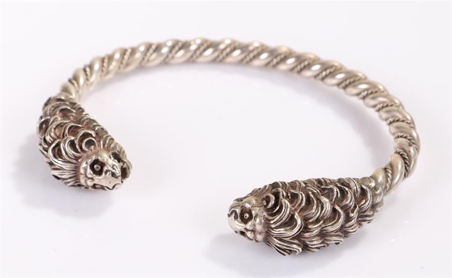 Silver bracelet, with a lion mask terminal to each end, 49 grams