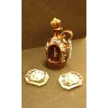 Two 19th Century glass brooches, with foil backs, together with two ash trays with classical