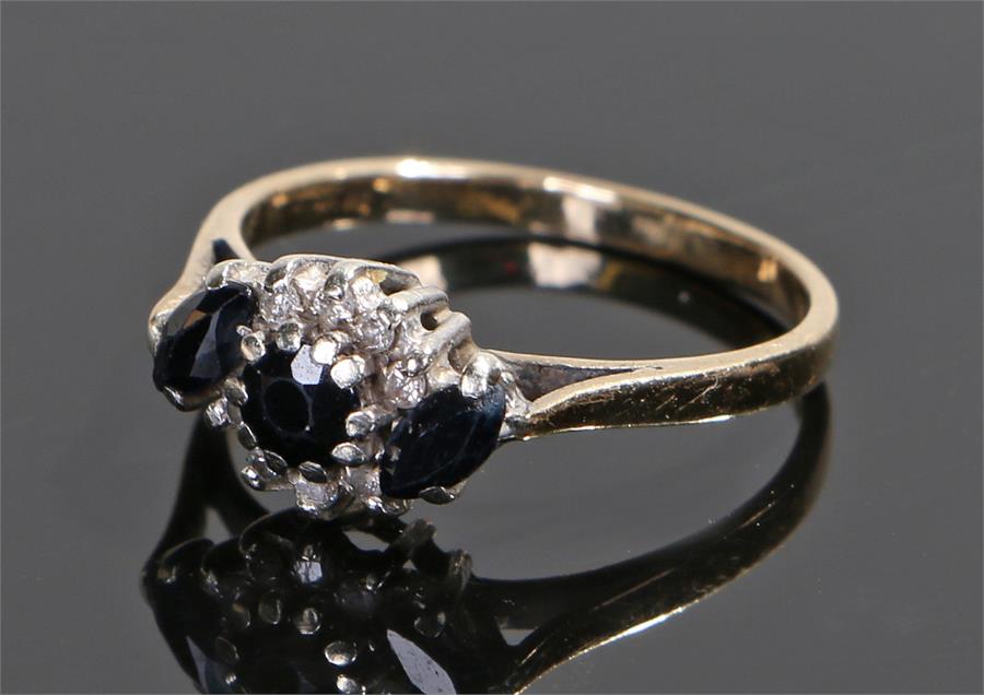 18 carat gold sapphire and diamond set ring, the head set with three sapphires and diamond to the